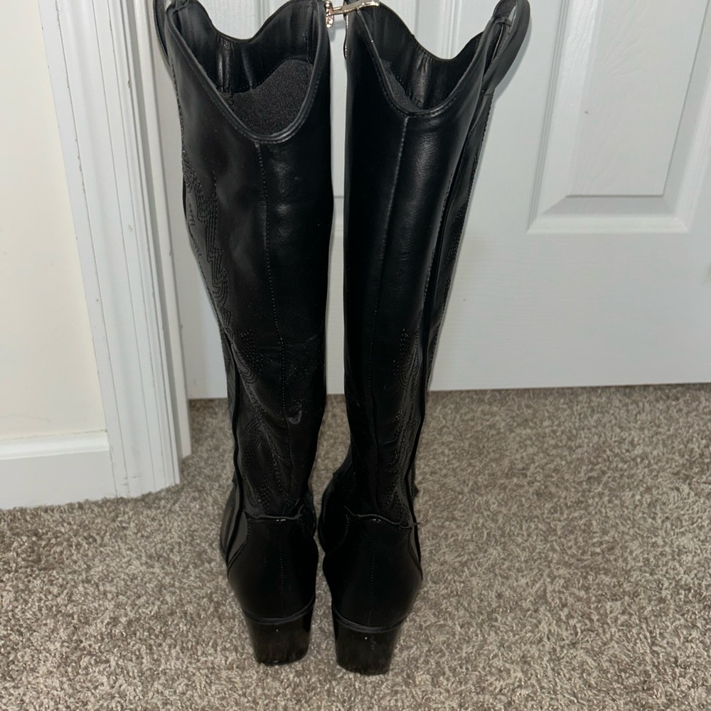 Woman’s knee high cowgirl boots